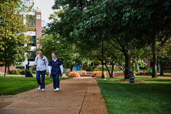 Two students walking on South Campus