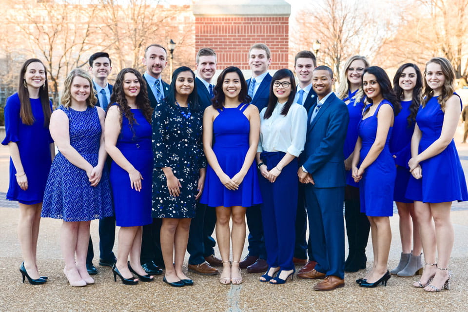 Spirit of the Billiken Class 2018 A group of students pose for a photo outside on campus.