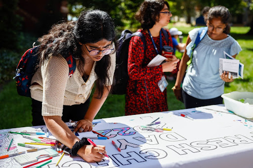 Students signing a banner Students signing a banner