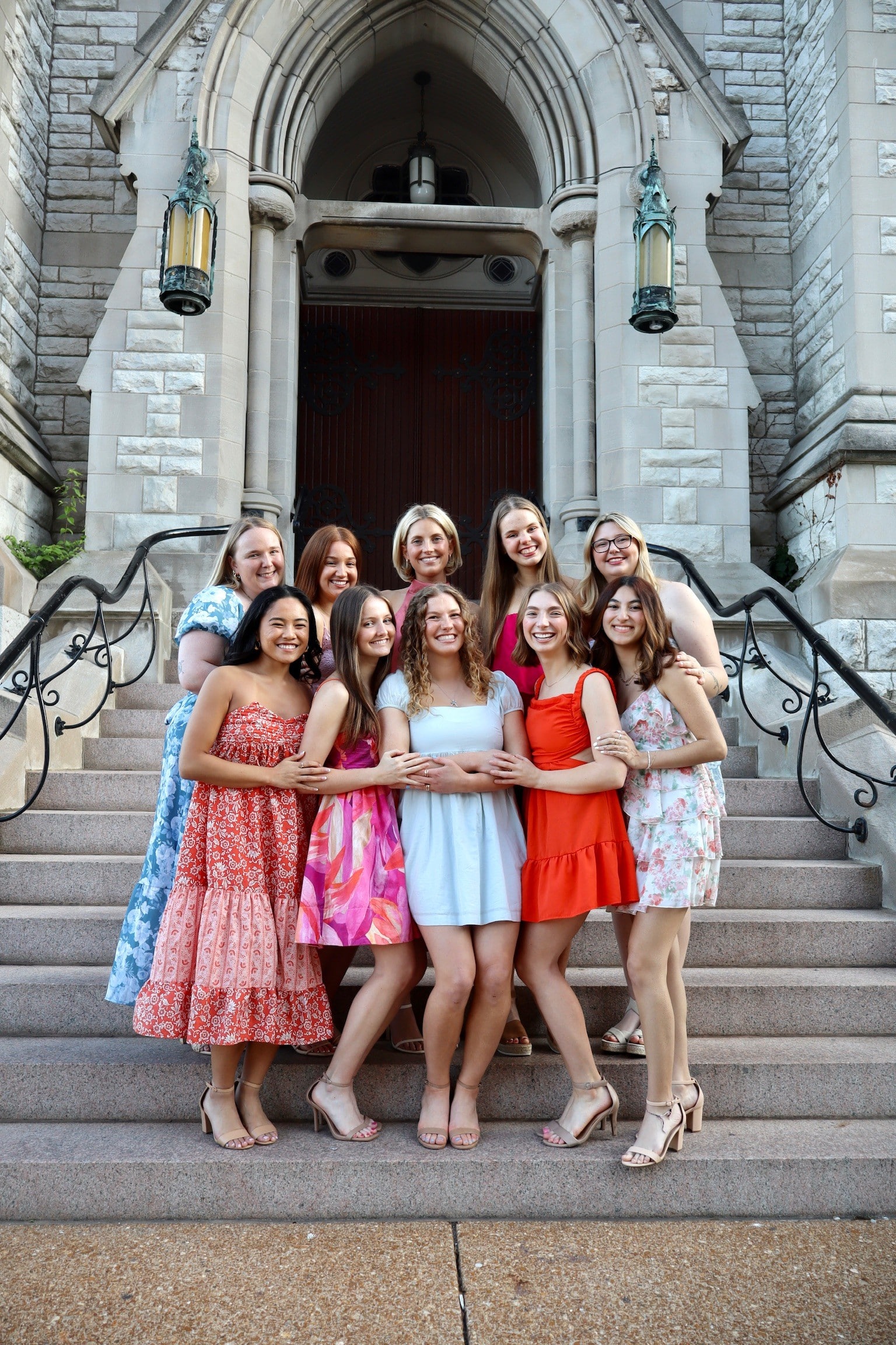 Ten young women pose in front of College Church