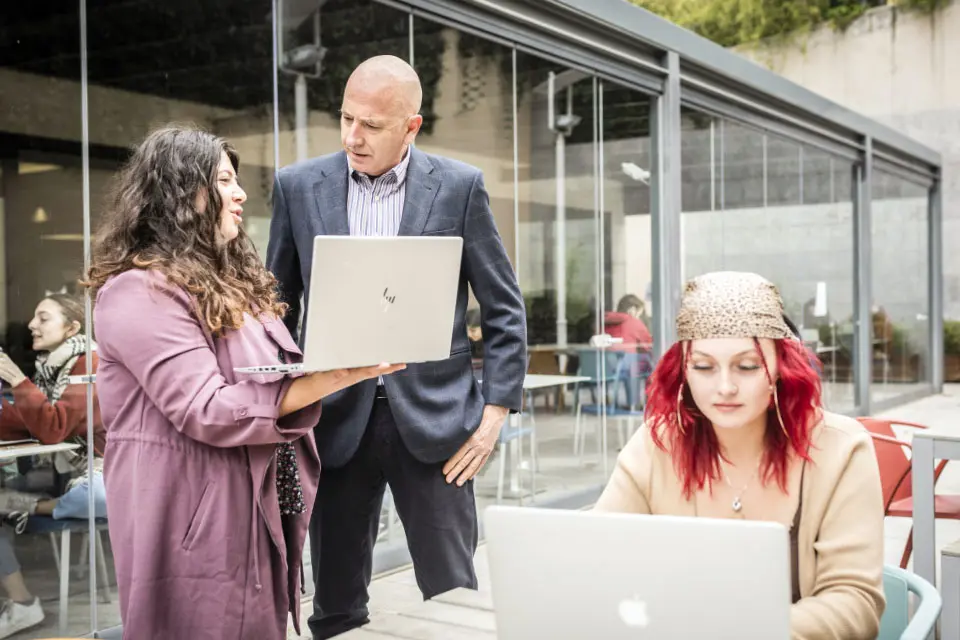 Humanities Department Dr. Francisco García Serrano with students at SIH patio