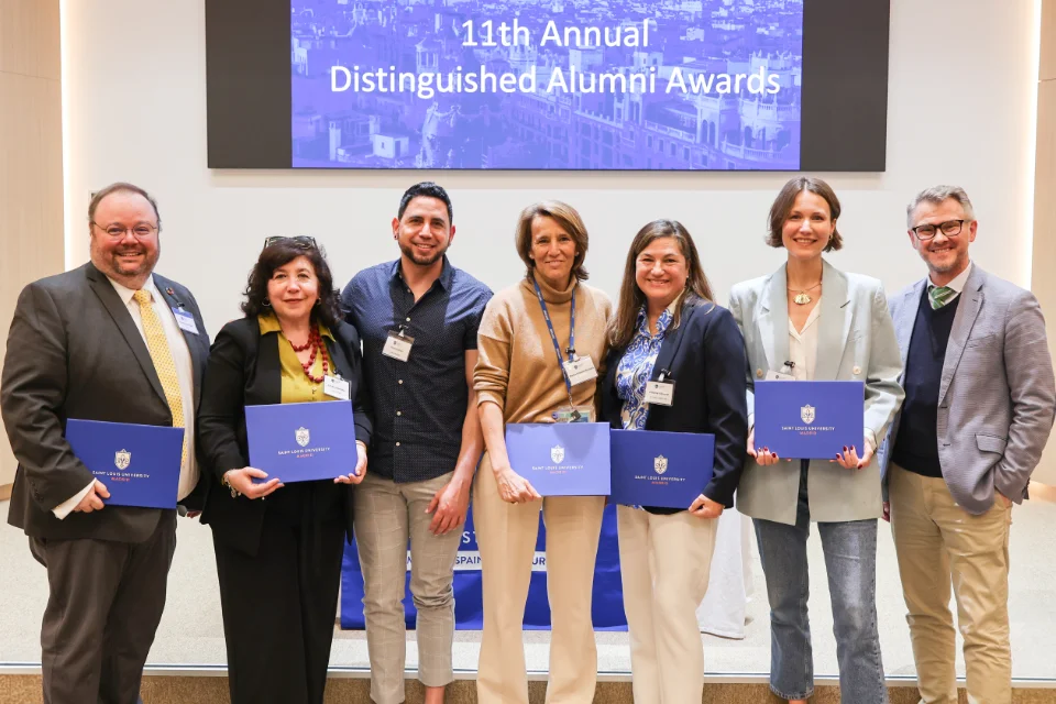 11th SLU-Madrid Distinguished Alumni Awards Ceremony Reflects Jesuit Mission Seven individuals pose for a photo with a screen behind them that reads "11th Annual Distinguished Alumni Awards".