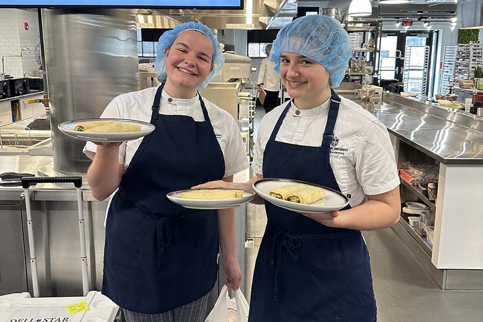 Senior students Hannah Bast and Anna Durfey clinched third place and a $1,000 prize for their innovative crepes filled with pesto chicken and roasted tomatoes. Submitted photo. 