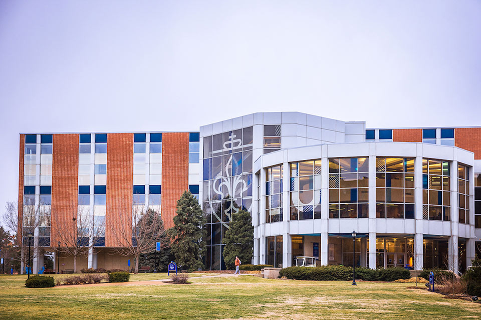 Exterior of Pius XII Memorial Library, a multi-story red brick building and large windows Exterior of Pius XII Memorial Library, a multi-story red brick building and large windows