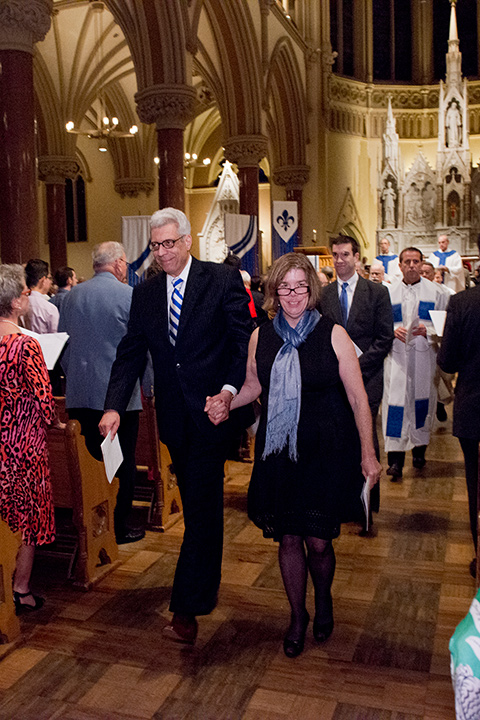 Fred and Fran Pestello walk down the aisle of St. Francis Xavier College Church after the inauguration Mass Dr. Fred Pestello and his spouse, Dr. Fran Pestello, walk hand-in-hand down the aisle of St. Francis Xavier College Church following the inauguration Mass on Oct. 2, 2014.