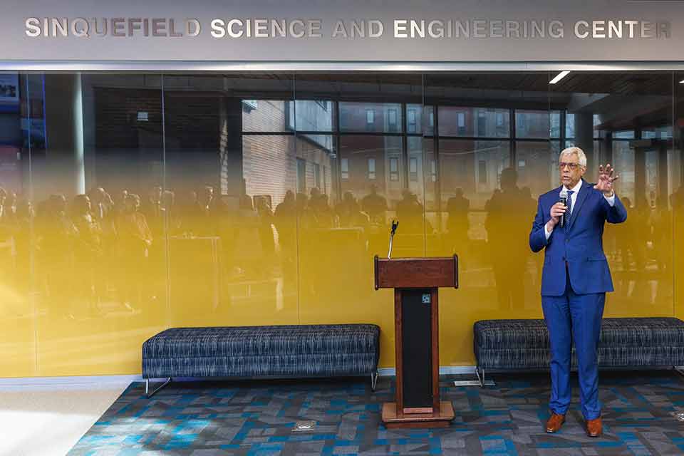 Fred Pestello Fred Pestello, Ph.D., on stage speaking at an event.